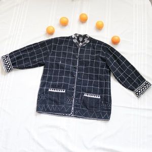Reversible black patterned coat